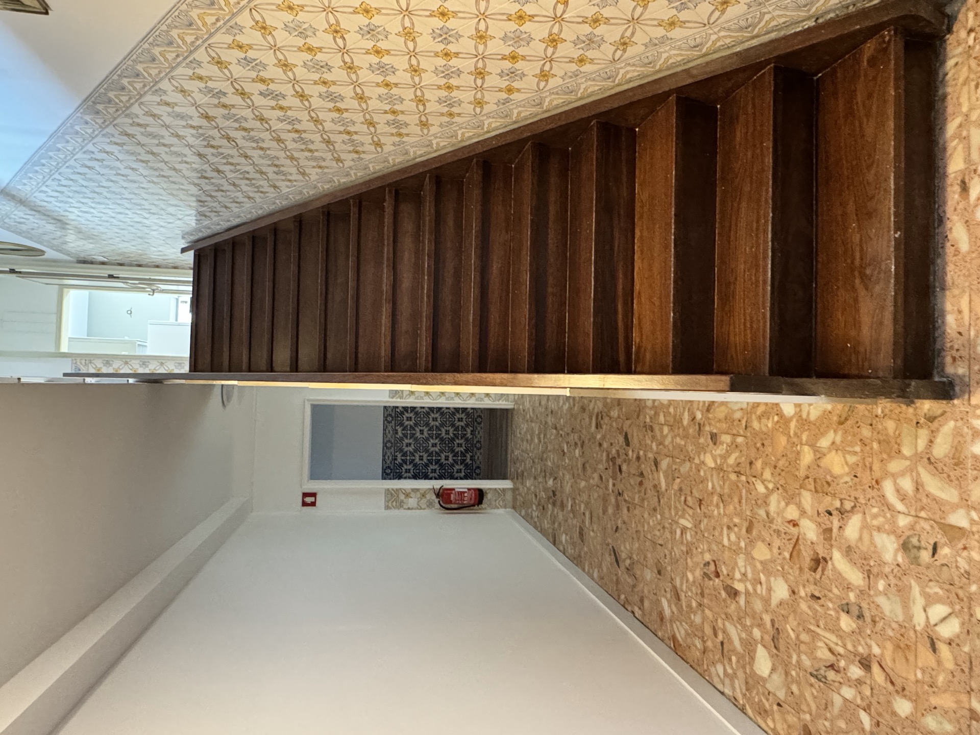 Bunk bed room with exposed stone wall